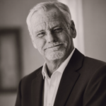 black and white photo of TP Adam