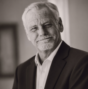 black and white photo of TP Adam